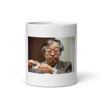 Product Image of a photograph showing Dorian Nakamoto, the accidental Satoshi legend, a sleek white glossy mug from Troll Social Club. Perfect for crypto enthusiasts and meme lovers